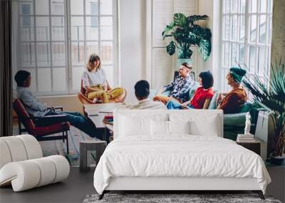 Multiracial friends gathering in spacious living room Wall mural