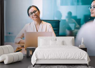 Smiling multiethnic coworkers on briefing in office Wall mural