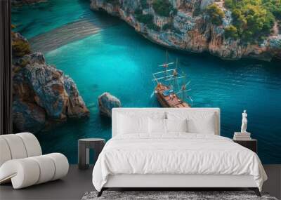 An amazing summer natural seascape with rocks and two ships in turquoise blue transparent sea water. Suitable for travel and vacations. Wall mural