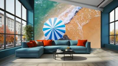 An umbrella with blue and white stripes on a sandy beach with turquoise water. Synthetic intelligence concept. Wall mural