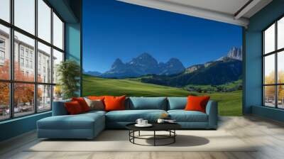 The Bregenzerwald, Dunst, and Saharasand are framed by orange and yellow lawns, farm houses, and a village in the valley as the Autumn sun sets in the valley. Wall mural