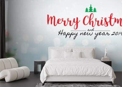 Christmas and Happy new year 2019 on blurred bokeh christmas tree banner background with snowfall. Wall mural