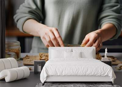 Closeup of Woman Preparing Healthy Granola Bar at Grey Marble Table in Kitchen Wall mural