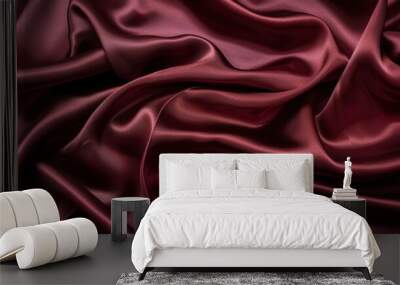 A close-up of satin fabric in a rich burgundy, with its smooth, shiny surface reflecting light Wall mural