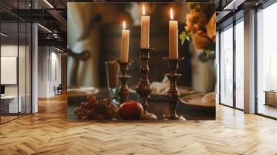 A set of bronze candlesticks on a dining table, adding an elegant touch to the setting Wall mural