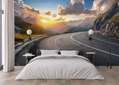 Mountain road at colorful sunset in summer. Dolomites, Italy. Beautiful curved roadway, rocks, stones, blue sky with clouds. Landscape with empty highway through the mountain pass in spring. Travel Wall mural