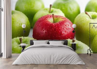 Red apple among green apples isolated on a white Wall mural