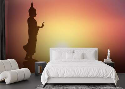 Silhouette of Buddha.Background sunrise Wall mural