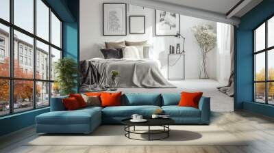 Vase on metal table and grey lamp in spacious bedroom with white carpet and gallery on wall above bed Wall mural