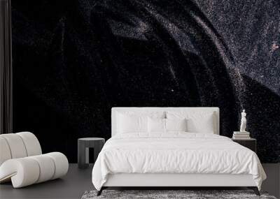 abstract real dust floating over black background for overlay Wall mural