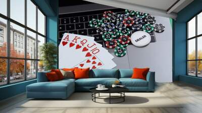 Poker cards and stacks of poker chips on a laptop computer. Poker online concept. Wall mural