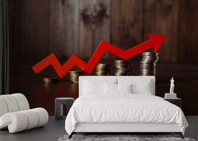 Red up arrow and stacks of gold coins. Investment concept Wall mural