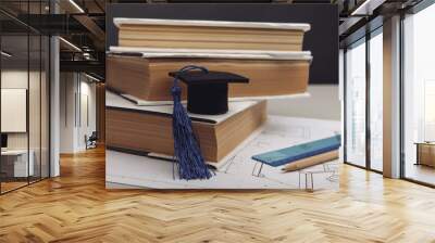 Technical project and graduation cap with books. Engineering education concept Wall mural