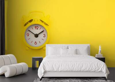 Yellow alarm clock Isolated on yellow trendy background. Rest hours time of life good morning night wake up awake concept. Space for text. Wall mural