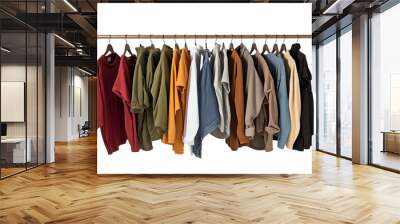 A variety of colorful clothing on hangers displayed on a wooden rod, showing assortment of casual and stylish fashion choices. Wall mural