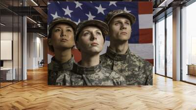 Three young military personnel in front of flag, horizontal Wall mural