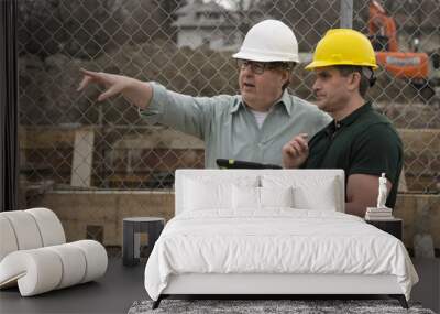 Two workers on a construction site using a tablet Wall mural