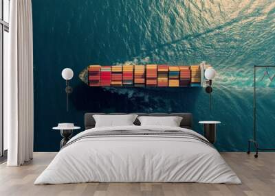 A lone cargo ship carrying colorful containers across a vast expanse of the ocean, aerial shot. Wall mural