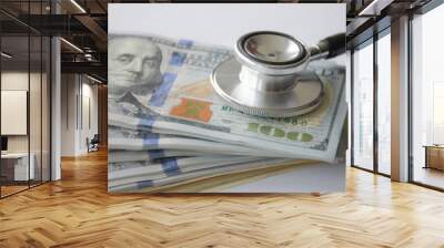 Big amount cash money with stethoscope as for health care and financial payment. Wall mural