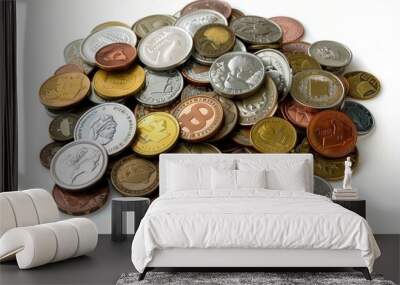 A pile of assorted international coins featuring different currencies and designs, isolated on a white background, representing global finance and travel. Wall mural