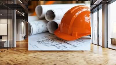 Construction planning essentials: orange helmet and blueprints for engineering projects Wall mural