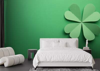 Green paper cutouts of four-leaf clovers arranged on a green background, symbolizing St. Patrick's Day, with ample copyspace for text or design. Wall mural