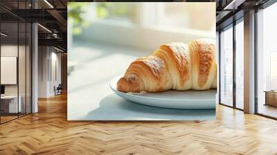 Morning breakfast bliss with a perfect croissant on a sunlit table Wall mural