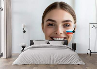 Portrait of a smiling woman with russian flag face paint for patriotic celebration Wall mural