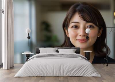 Professional japanese businesswoman smiling in modern office setting for corporate media use Wall mural