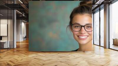 Spring portrait of smiling young woman with glasses and bun for fashion and lifestyle inspiration Wall mural