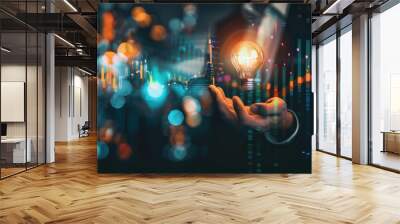 Businessman holding creative light bulb with growth graph, analytics icons. Utilizing analytics technology to develop new strategies and insights that enhance successful performance in global busines Wall mural