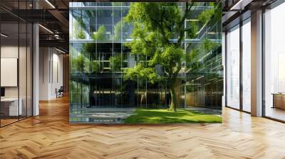 Sustainable green building. Eco-friendly building. Sustainable glass office building with tree for reducing carbon dioxide. Office with green environment. Corporate building reduce CO2. Wall mural