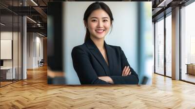 Young confident smiling Asian business woman leader, successful entrepreneur, professional company executive ceo manager, wearing suit standing in office with arms crossed. Made with generativ ai Wall mural