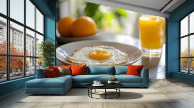 A breakfast table with lab grown eggs sunny side up and orange juice symbolizing the normalcy of lab grown food in future diets Wall mural