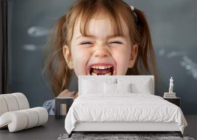 Joyful Child Showing Off Broken Tooth with Bright Smile Portraying Childhood Innocence and Resilience Wall mural