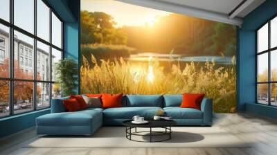 Serene landscape of reed meadow by river at sunset picturesque scene capturing tranquil beauty of nature with golden sunlight reflecting on water perfect for backgrounds depicting environments Wall mural