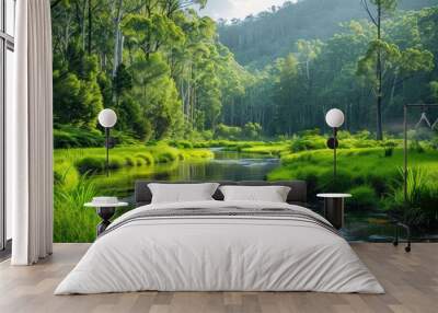 Tranquil nature view featuring meandering river through lush grassy landscape beauty with green trees and clear water ideal for capturing essence of peaceful outdoor environments of forest parks Wall mural