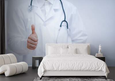 Doctor Showing thumbs up for best health and insurance package plan for advertising, over isolated white background, medicine, healthcare and pandemic concept Wall mural