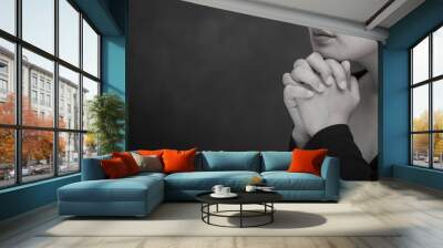 praying and worship to god using hands to pray with book in religious beliefs and worship christian  Wall mural