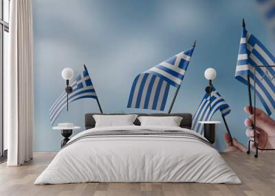 A group of people holding small flags of the Greece in their hands Wall mural