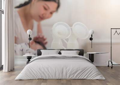 Auto breast pump machine, mothers breast milk is the most healthy food for newborn baby. Happy mother. Wall mural