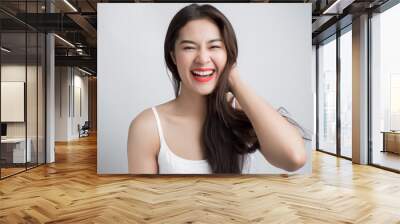 Young beautiful Asian woman with smiley face. Wall mural