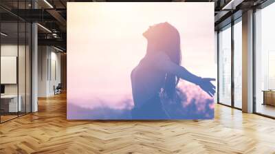 Young woman relaxing in summer sunset sky outdoor. People freedom style. Wall mural