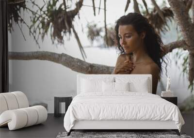 Naked Beach Woman Perfectly Tanned on Wild Rocky Seashore Wall mural