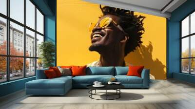 Happy afro man in stylish sunglasses on yellow wall background Wall mural