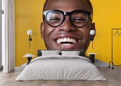 Man wearing glasses smile happy face portrait with yellow background Wall mural