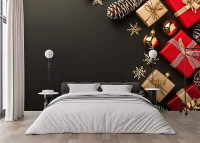 Colorful Christmas gifts and decorations arranged on a dark background for festive holiday celebrations in December Wall mural