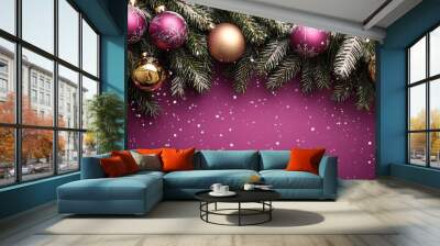 Elegant Christmas ornaments hanging on green pine branches with snowflakes falling on a purple background during the holiday season Wall mural