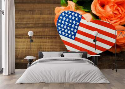 USA flag in the form of hearts and flowers on a wooden background Wall mural