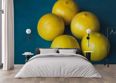 Persian Sweet lemons (Citrus limetta) with a dark blue background Wall mural